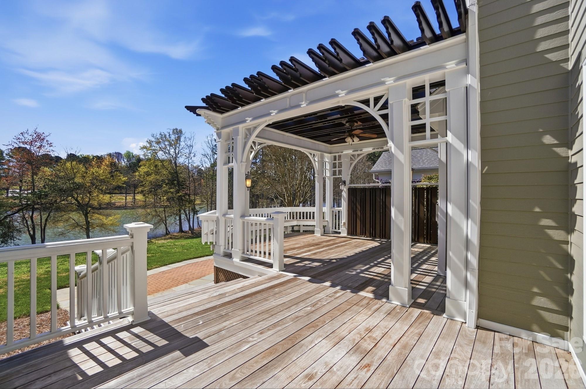 159 Lavender Bloom Loop Mooresville, NC 28115 - Photo 36 of 48 a view of a deck with couches with wooden floor and fence