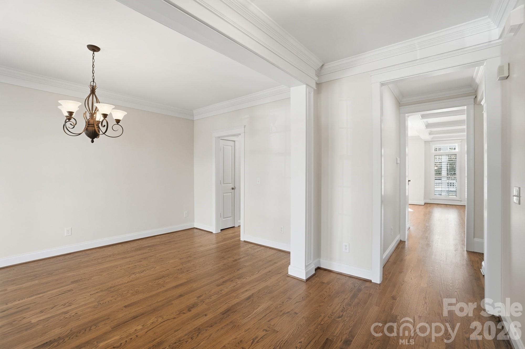 159 Lavender Bloom Loop Mooresville, NC 28115 - Photo 7 of 48 a view of an empty room with wooden floor