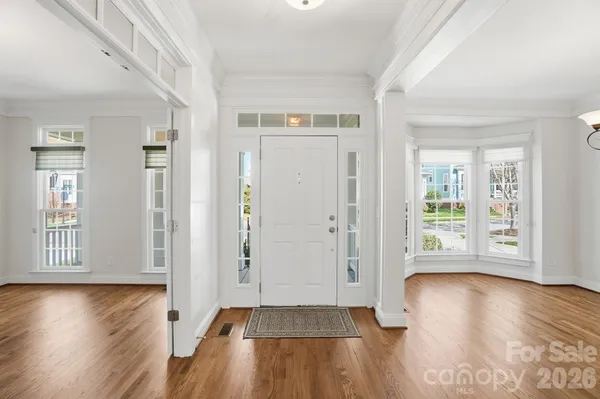 a kitchen with granite countertop wooden cabinets and a stove top oven