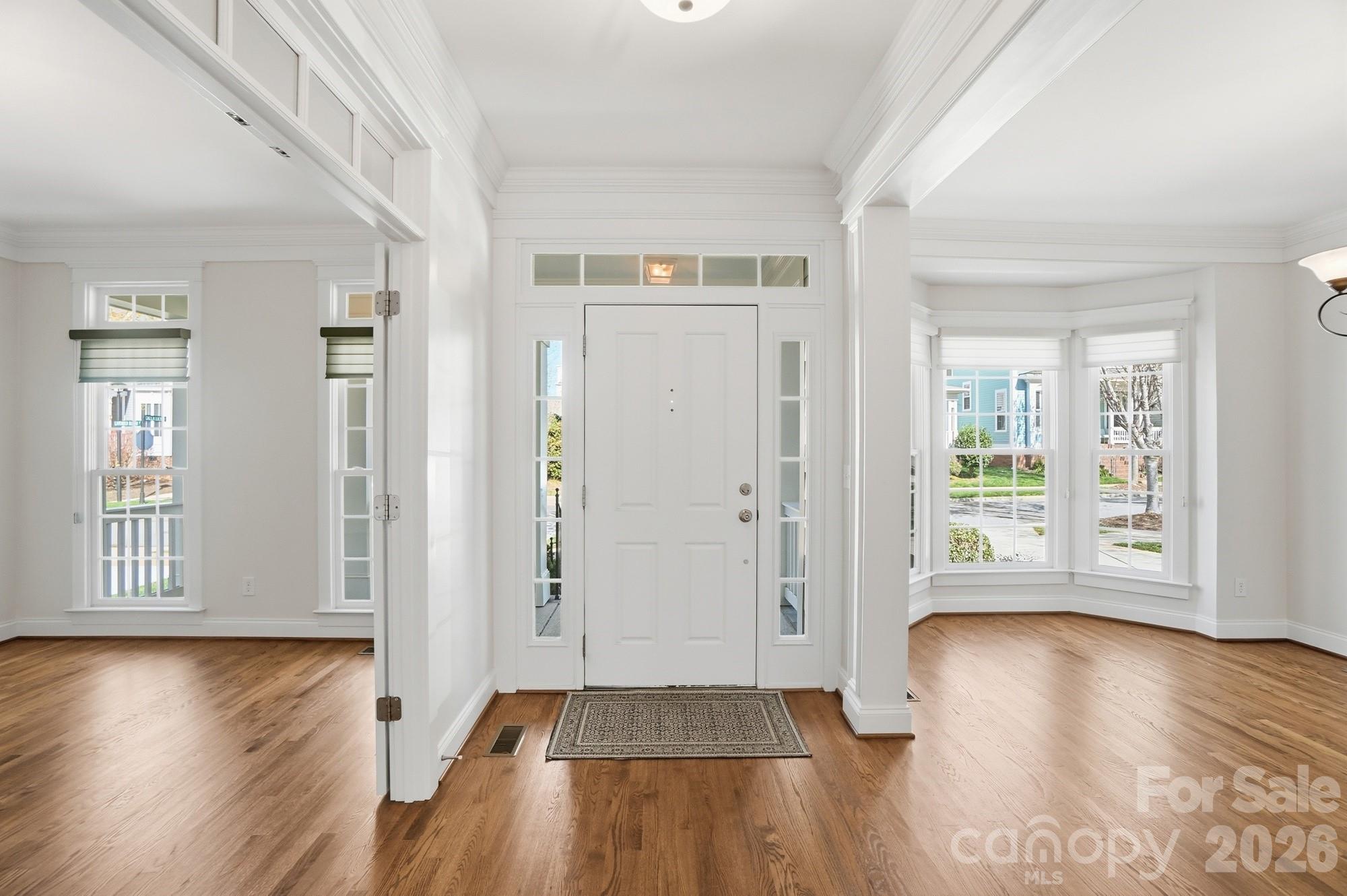 159 Lavender Bloom Loop Mooresville, NC 28115 - Photo 8 of 48 an empty room with wooden floor and windows