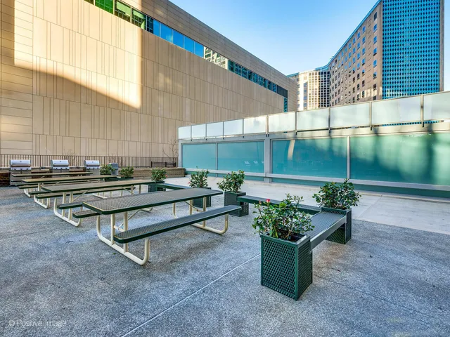 a backyard with a table and chairs