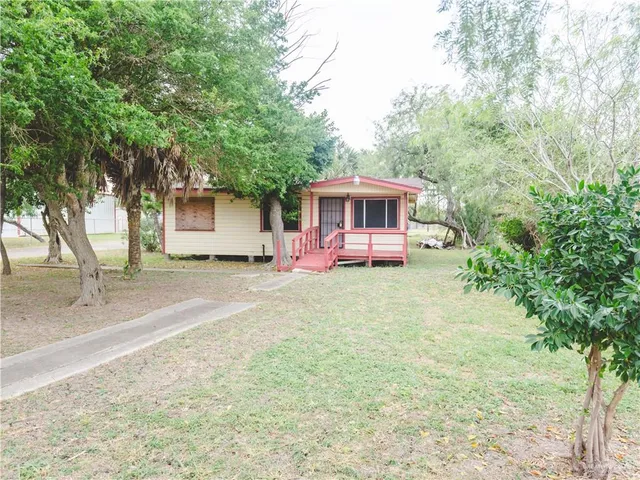 front view of a house with a yard