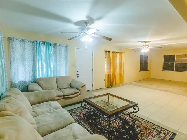 a view of a livingroom with furniture and a flat screen tv