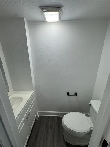a bathroom with a toilet and a sink
