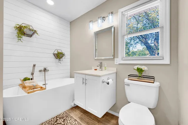 a bathroom with a sink a toilet and a bathtub