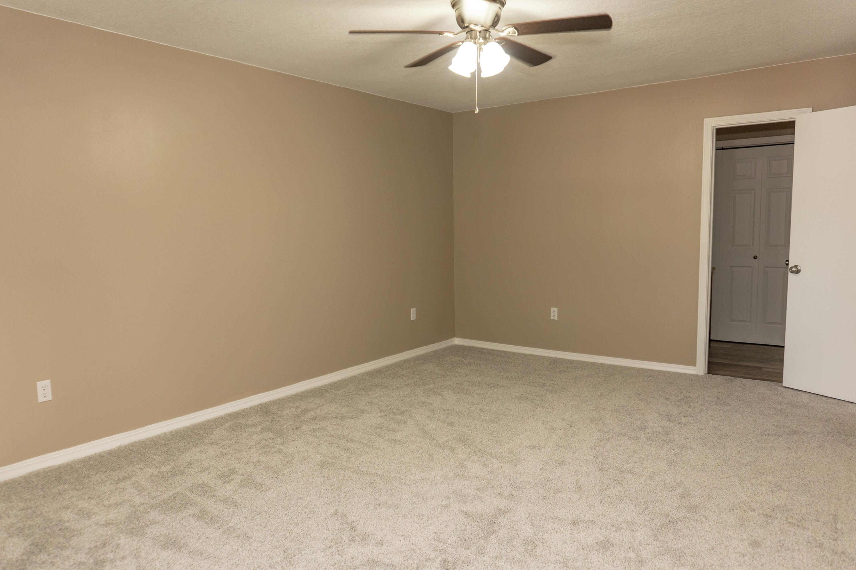 102 Brian Drive Crestview, FL 32536 - Photo 16 of 23 an empty room with a fan & a window