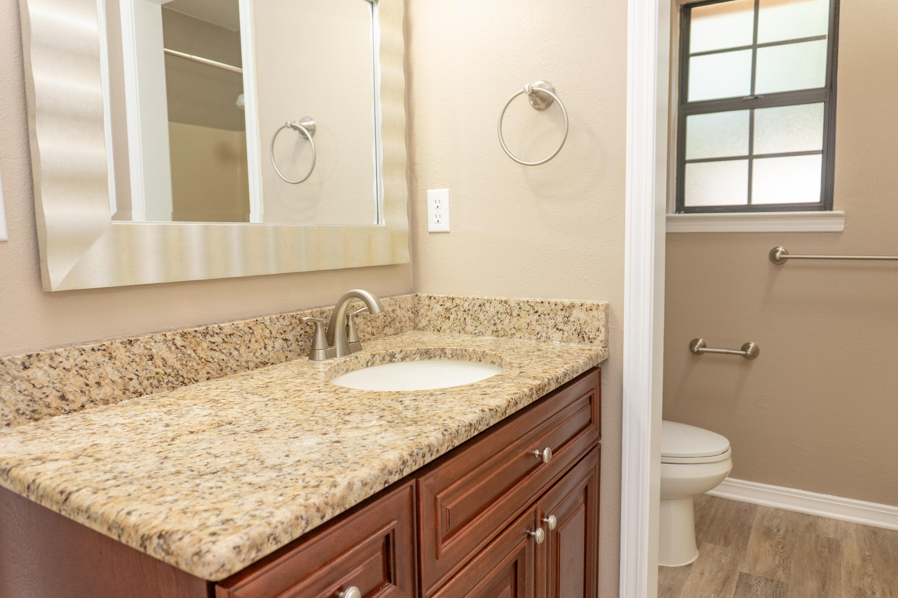 102 Brian Drive Crestview, FL 32536 - Photo 18 of 23 a bathroom with a granite countertop sink and a mirror