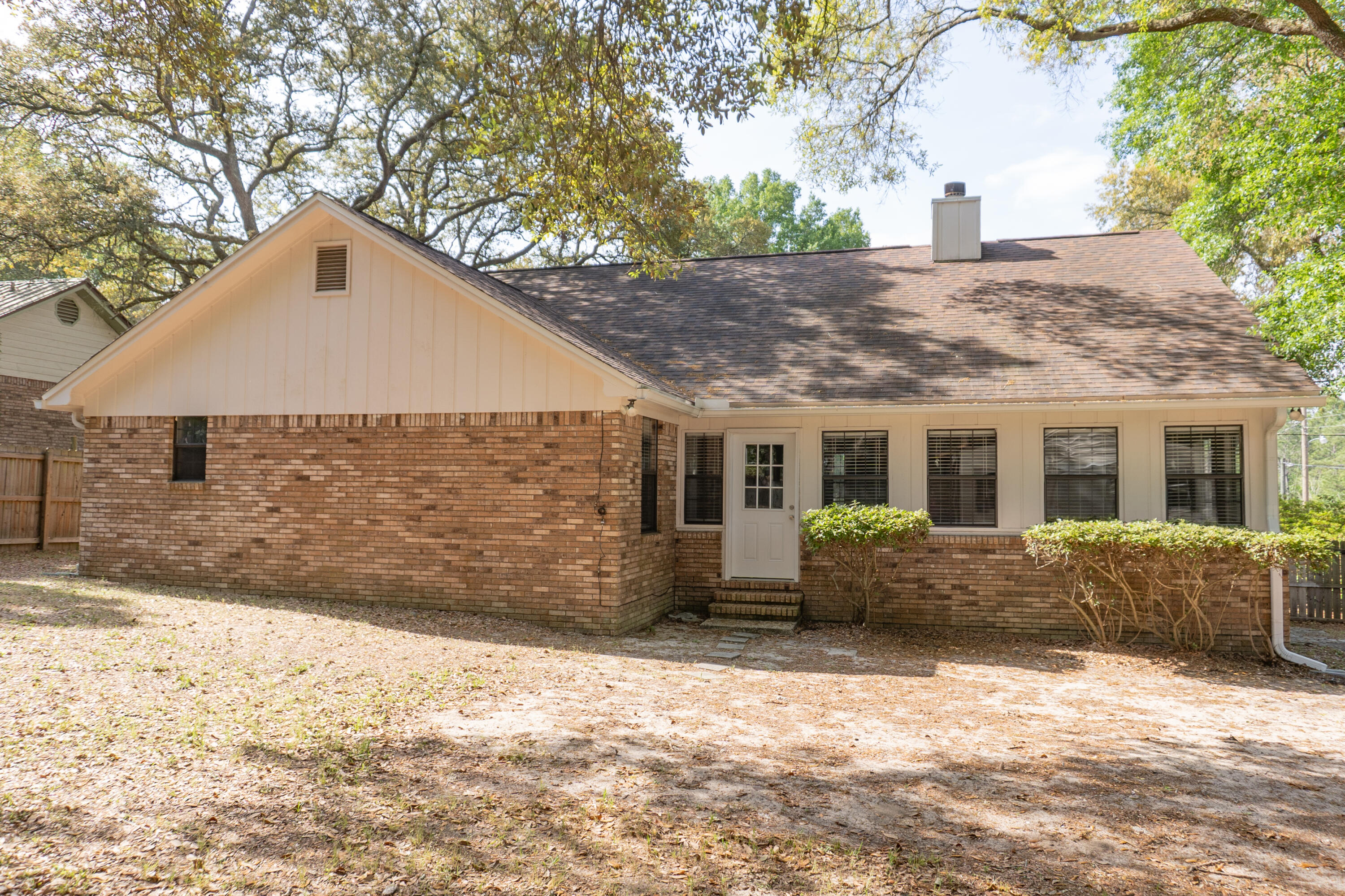 102 Brian Drive Crestview, FL 32536 - Photo 20 of 23 a front view of a house with a yard and garage