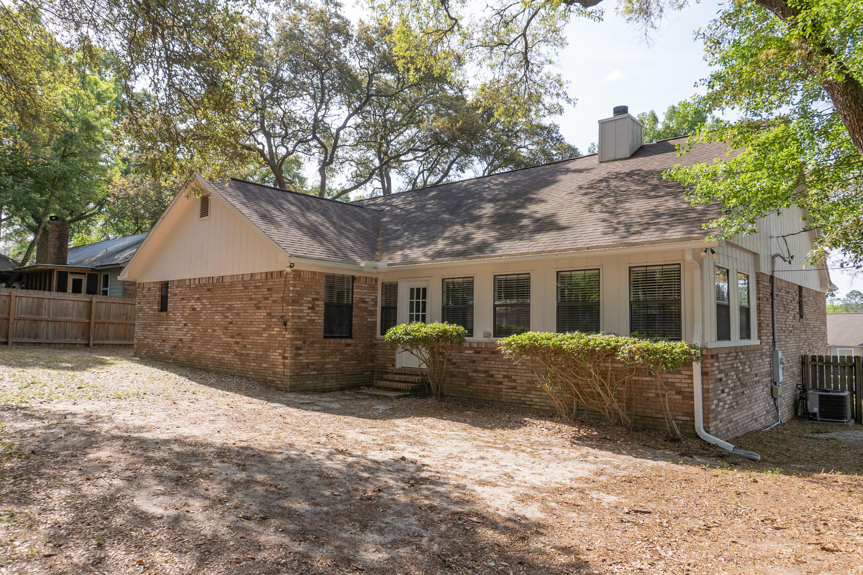 102 Brian Drive Crestview, FL 32536 - Photo 21 of 23 a front view of house with a yard and seating space