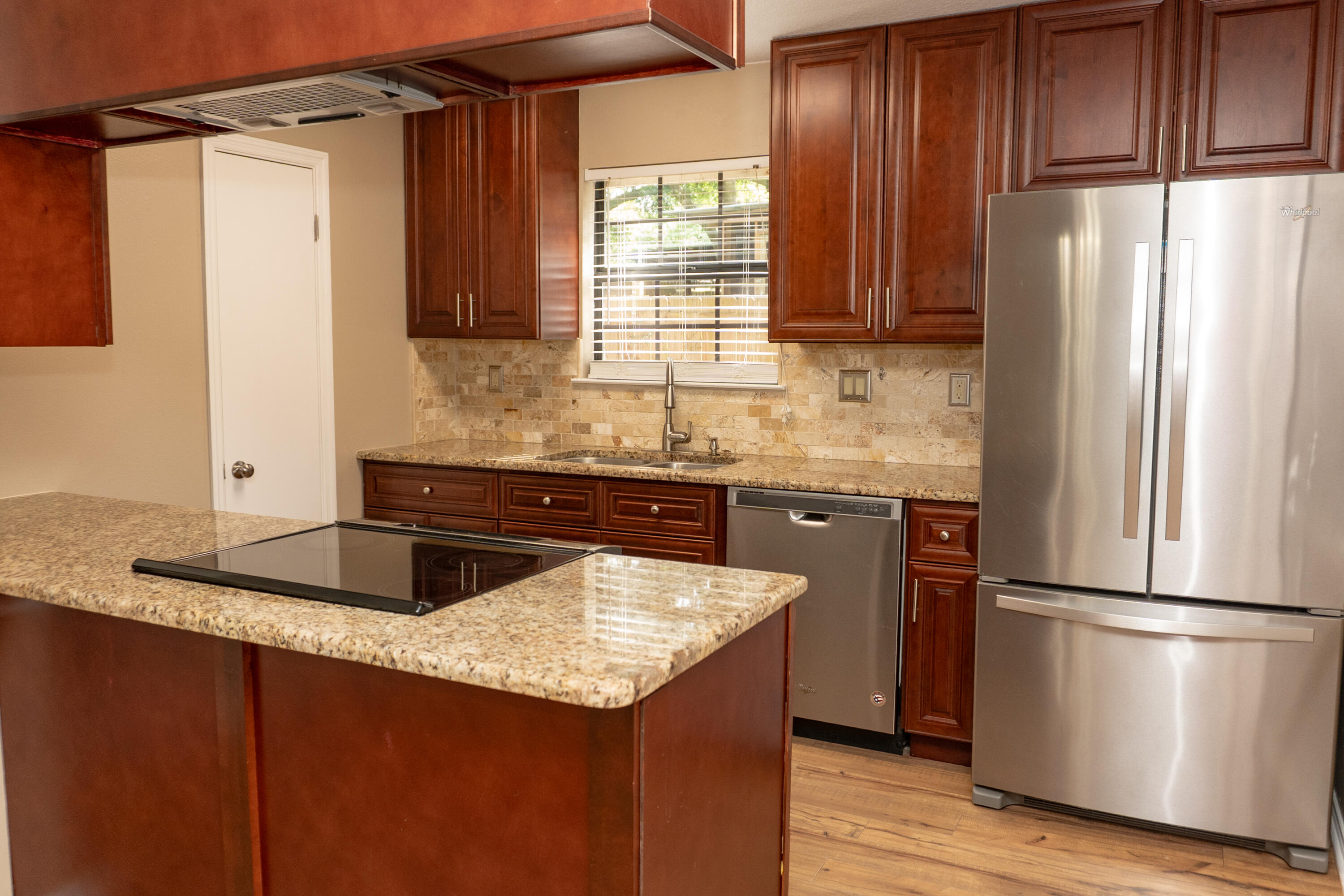 102 Brian Drive Crestview, FL 32536 - Photo 5 of 23 a kitchen with granite countertop stainless steel appliances a refrigerator sink and cabinets