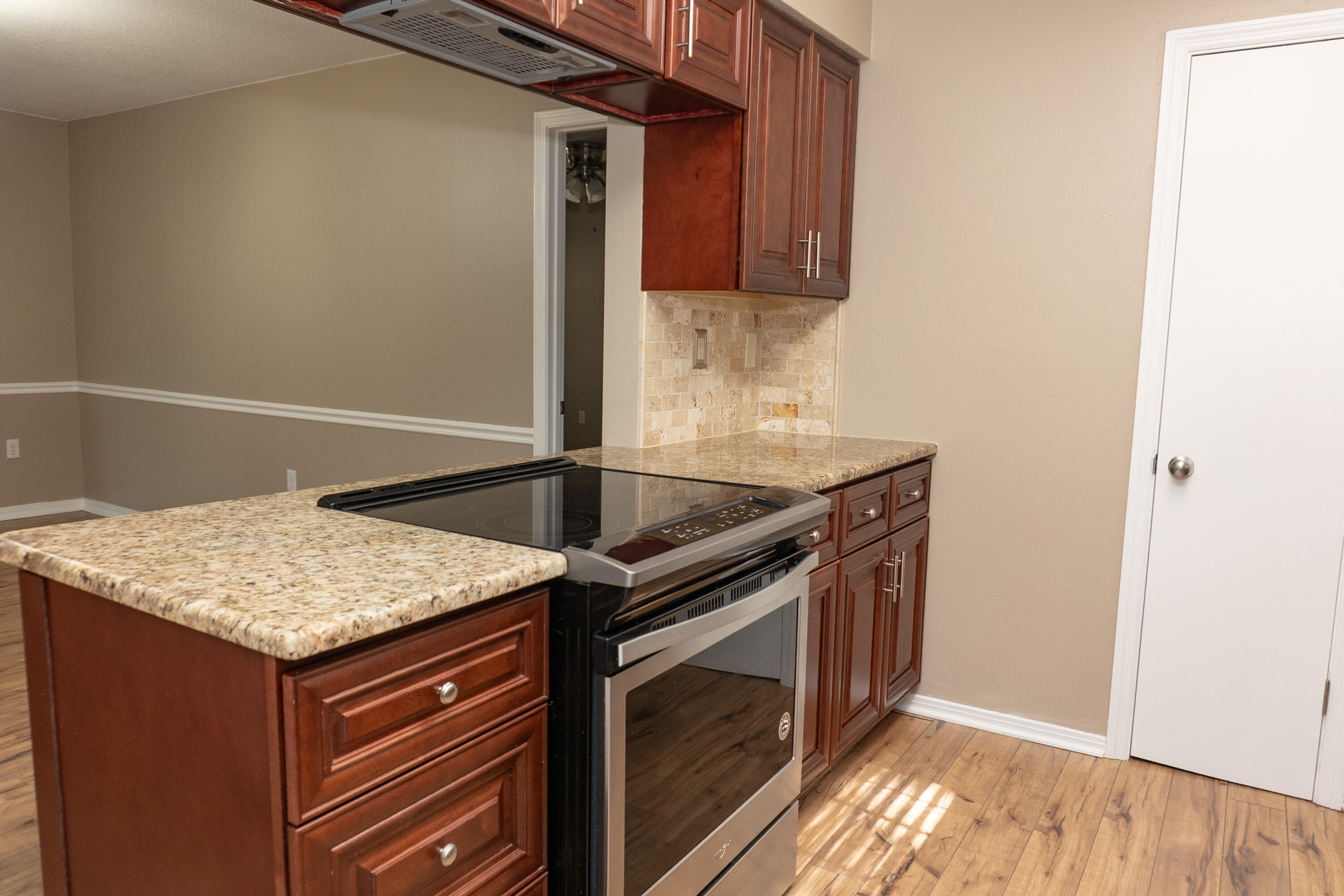 102 Brian Drive Crestview, FL 32536 - Photo 6 of 23 a kitchen with granite countertop a sink stove and cabinets