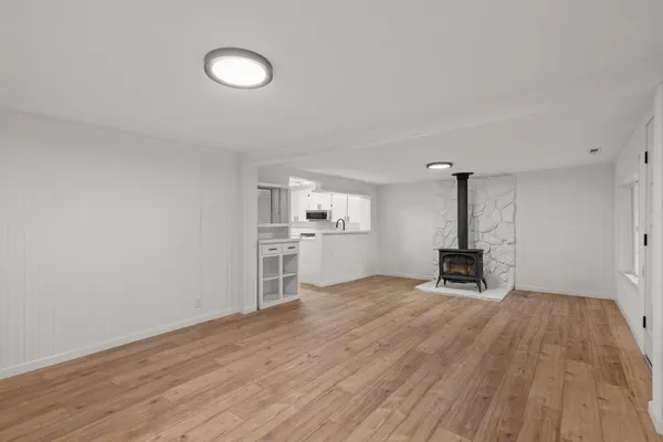 a view of a kitchen with a sink and a stove