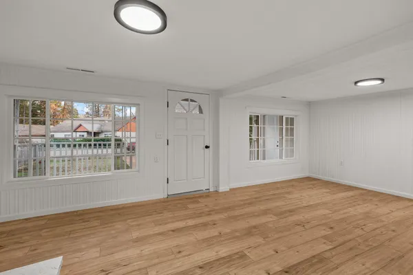 a view of an empty room with a window