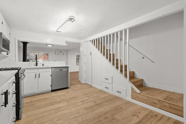 a view of a kitchen with sink and entryway