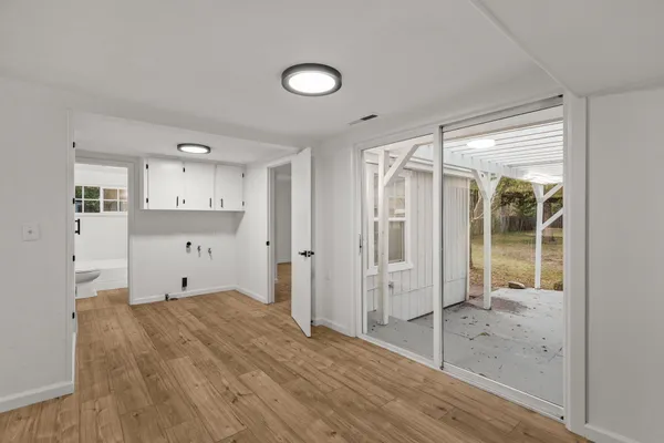 a view of kitchen with wooden floor and window
