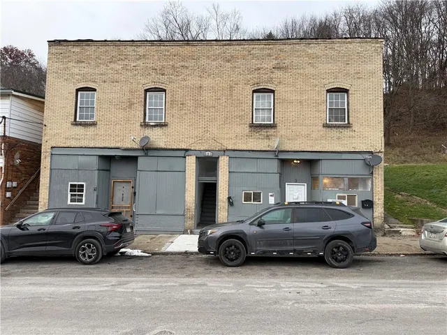 a car parked in front of a house