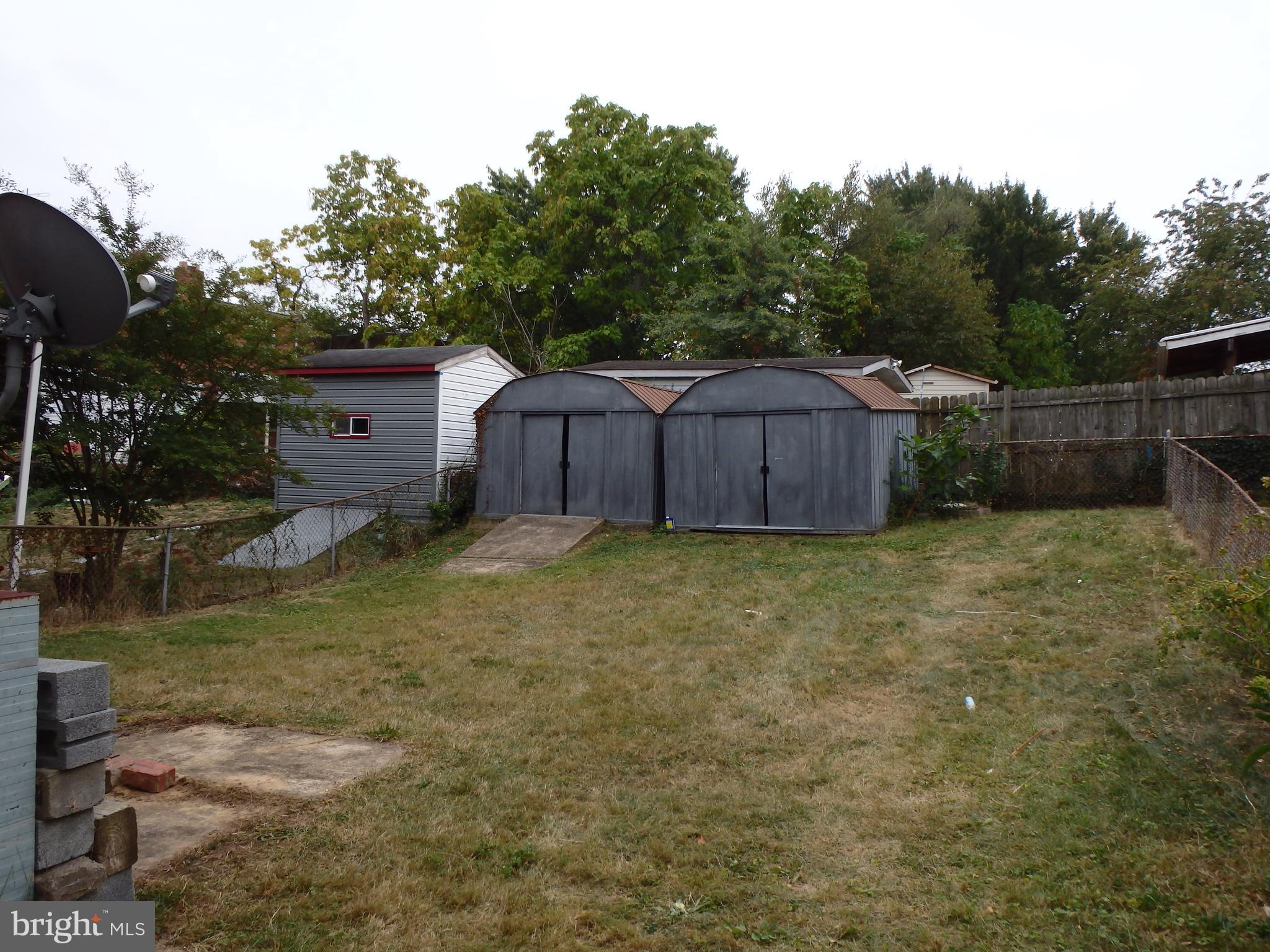 1123 Quebec Street Silver Spring, MD 20903 - Photo 4 of 29 Back yard with two sheds