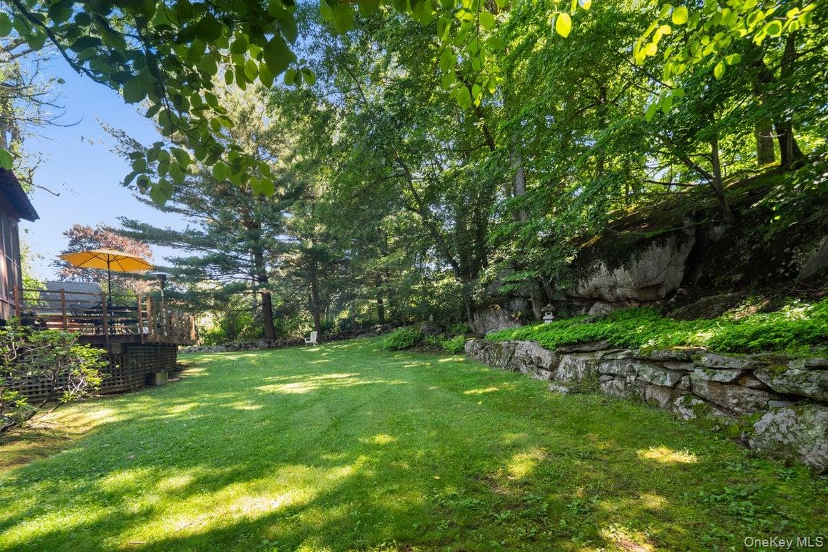1821 Spring Valley Road Ossining, NY 10562 - Photo 40 of 48 Relax on the deck, explore the beauty of nature, and enjoy playing in the yard.