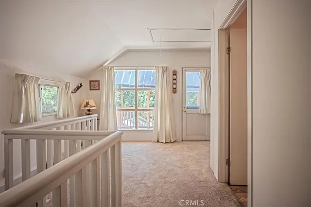 a view of a hallway with windows