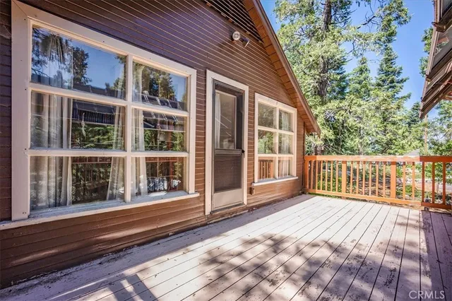a view of a brick house with large windows