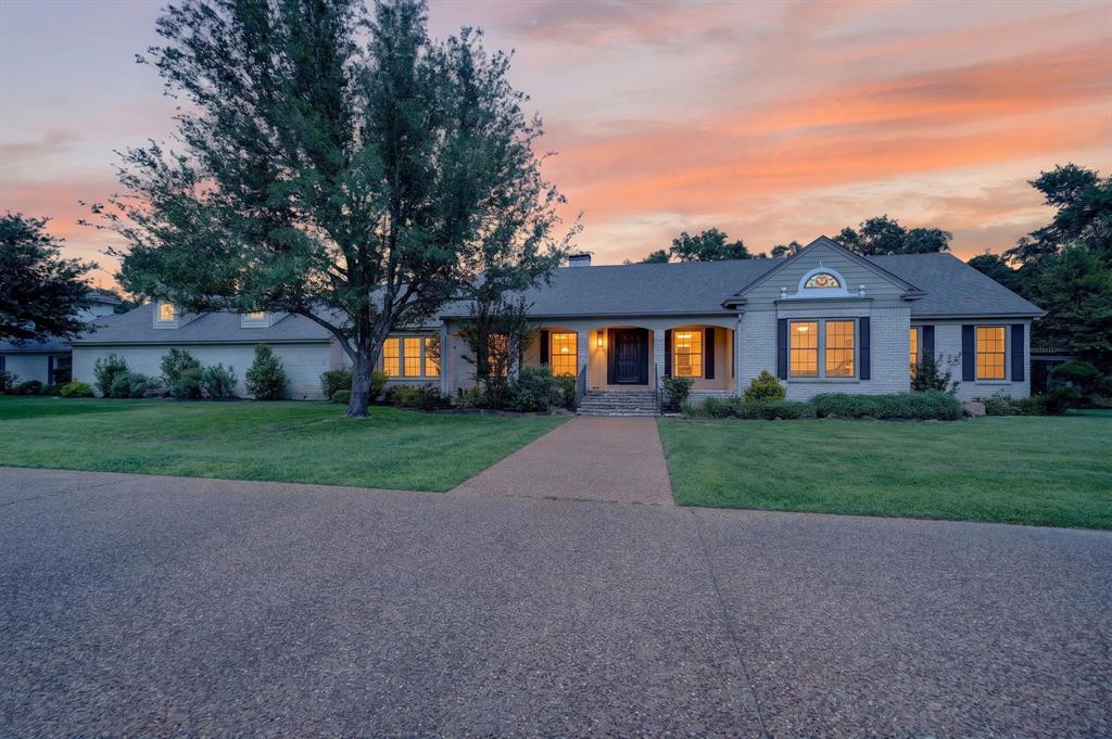 1901 Rose Pointe Athens, TX 75752 - Photo 1 of 37 Light-colored brick exterior with dark shutters and a gray roof