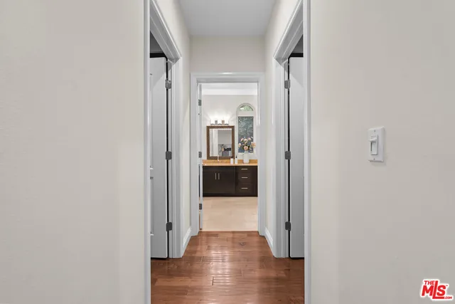 a spacious bathroom with a bathtub shower sink mirror and toilet