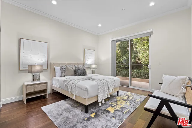 a bedroom with a large bed and a table