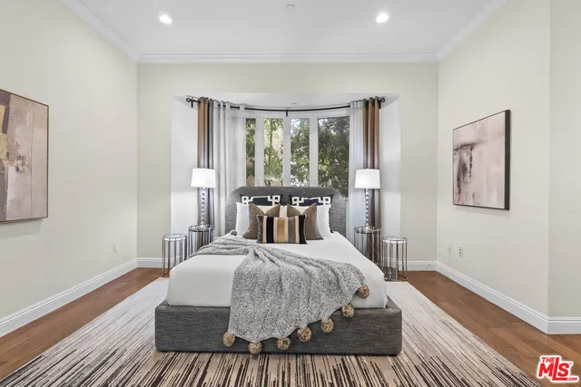 a view of living room with furniture and wooden floor