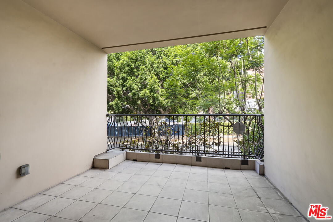 4848 Wilshire Boulevard, Unit 102 Los Angeles, CA 90036 - Photo 41 of 47 a view of a room with sliding door and mountain view