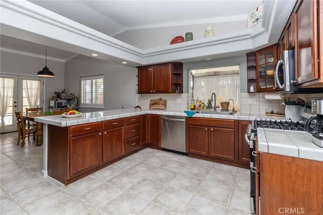 a kitchen with a sink stove and cabinets