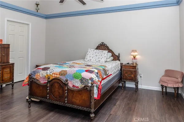 a bedroom with a bed and a chair
