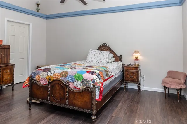 a bedroom with a bed and a chair