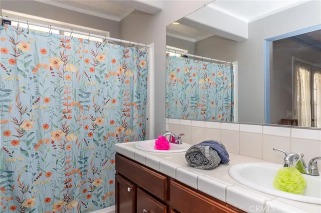 a bathroom with a sink and a shower curtain