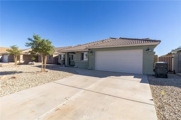 a front view of a house with a garage