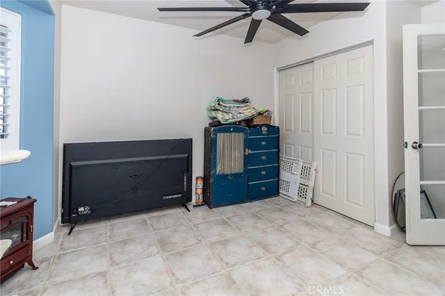 a room with a dresser and a window