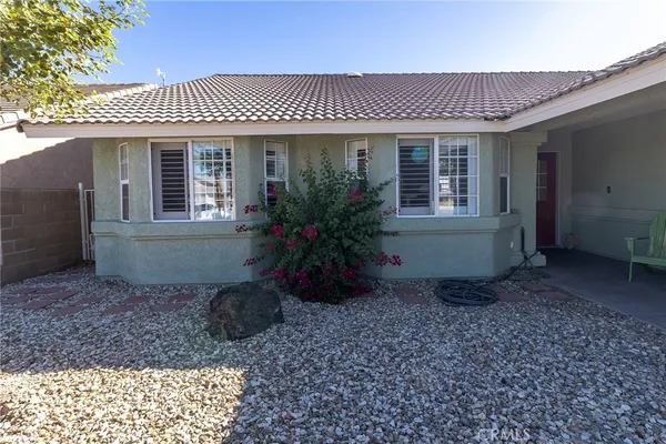 a view of a house with a garden
