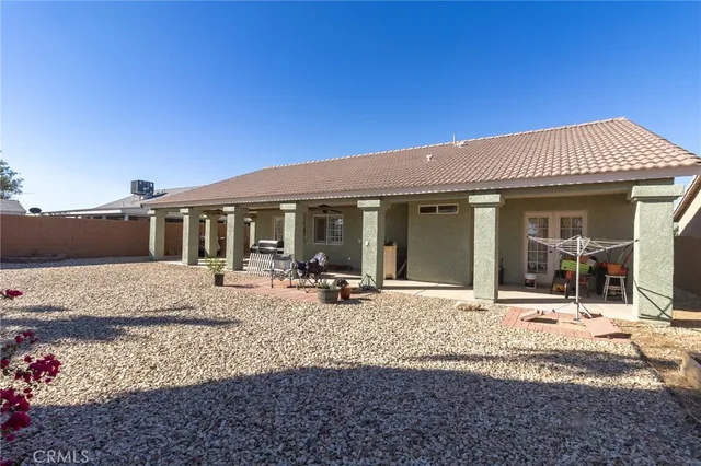 a front view of a house with sitting area