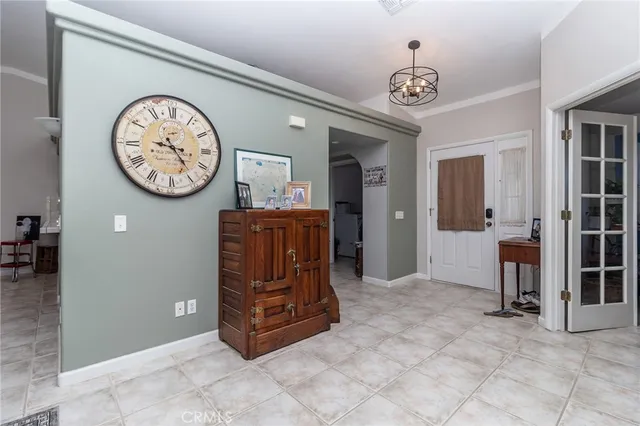 a large space with a large mirror and a clock on the wall