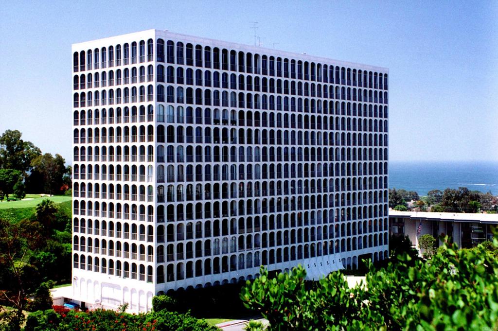 a view of a building with a garden