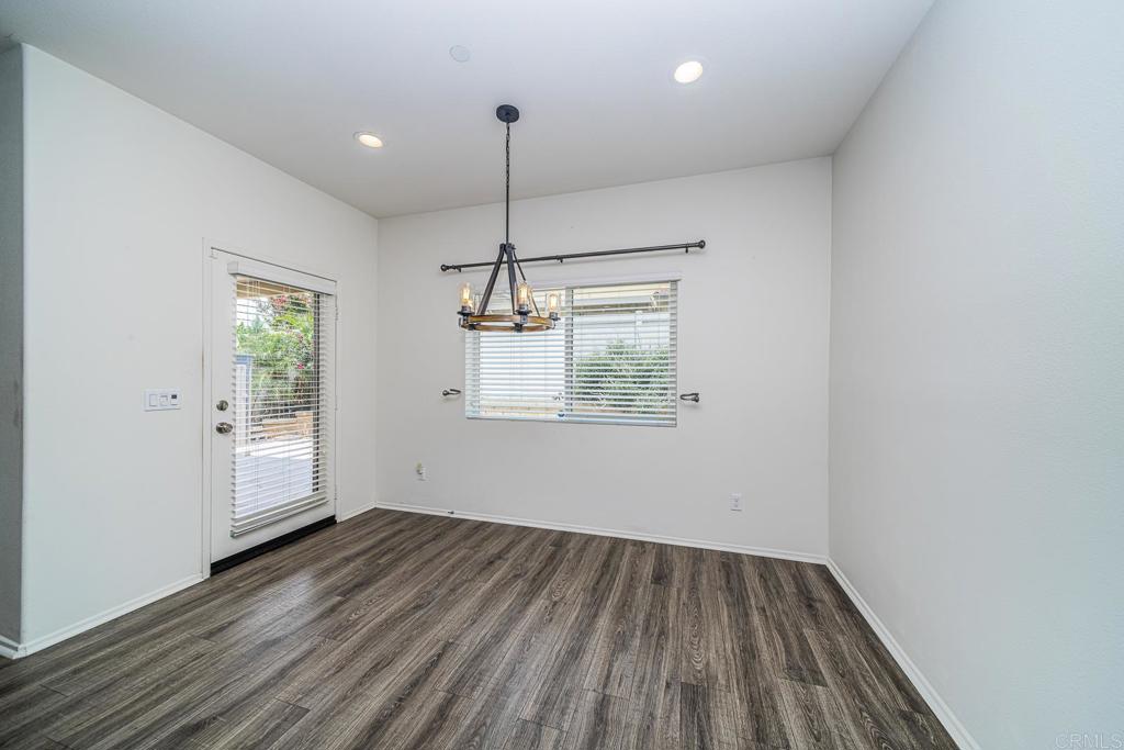 340 Falabella Lane Fallbrook, CA 92028 - Photo 19 of 63 wooden floor in an empty room with a window
