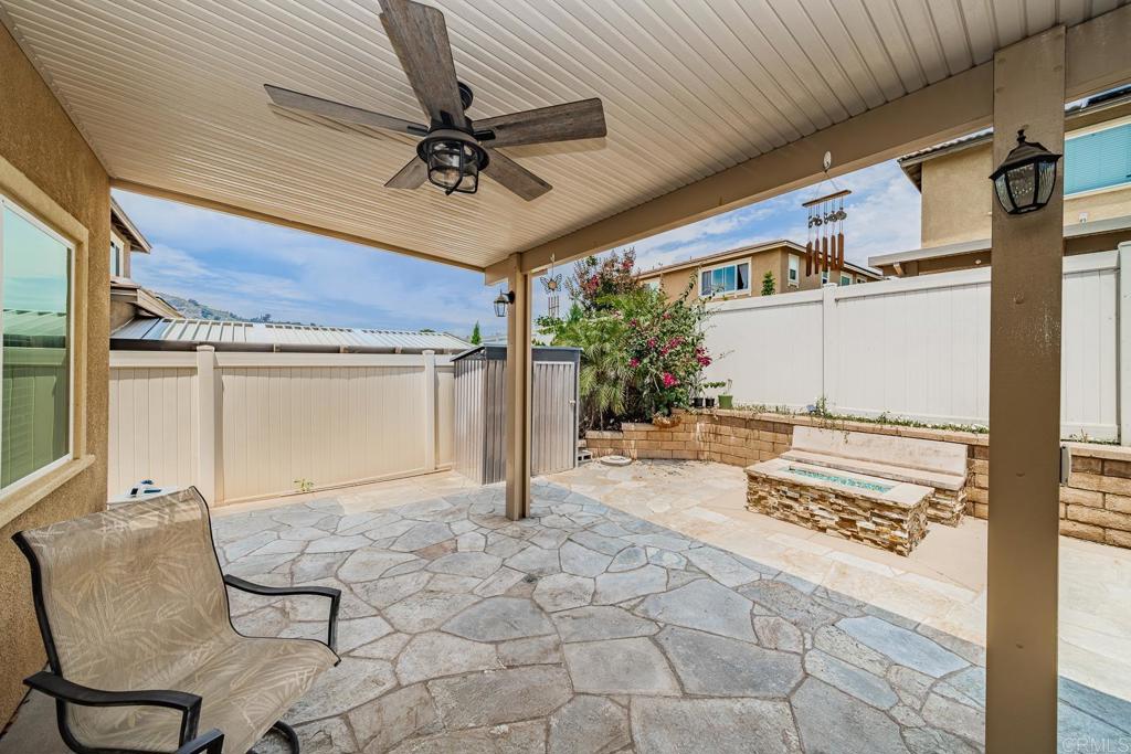 340 Falabella Lane Fallbrook, CA 92028 - Photo 21 of 63 a view of a porch with a table and chairs