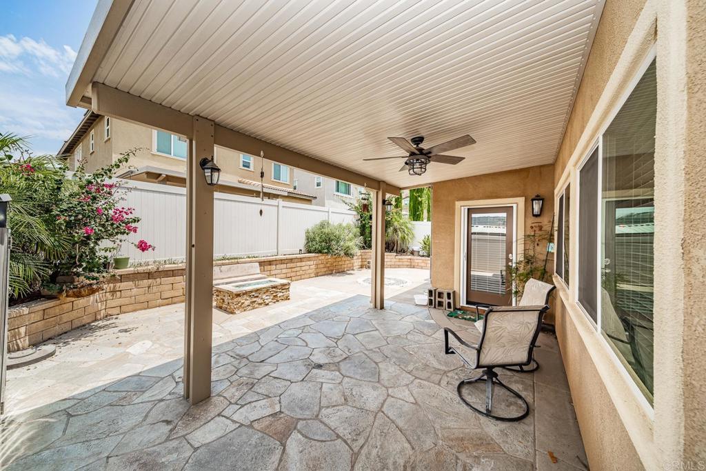 340 Falabella Lane Fallbrook, CA 92028 - Photo 22 of 63 a view of a porch with chairs and backyard of the house