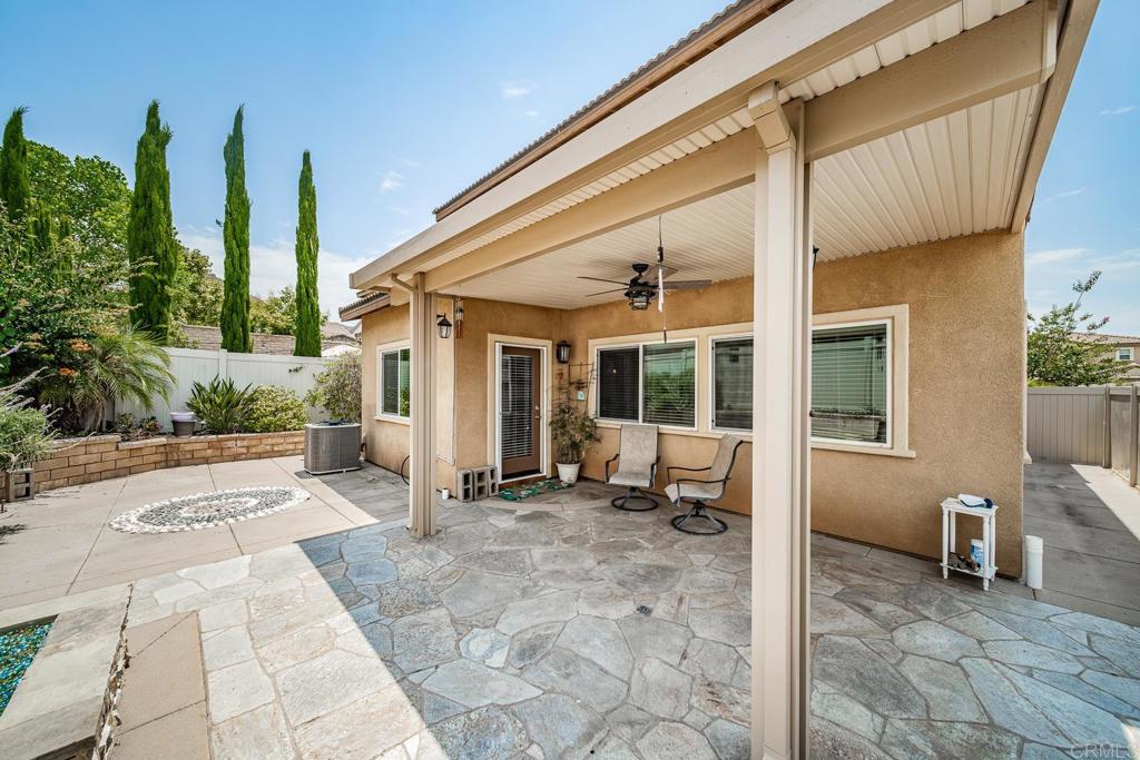340 Falabella Lane Fallbrook, CA 92028 - Photo 23 of 63 a view of a house with backyard sitting area and porch