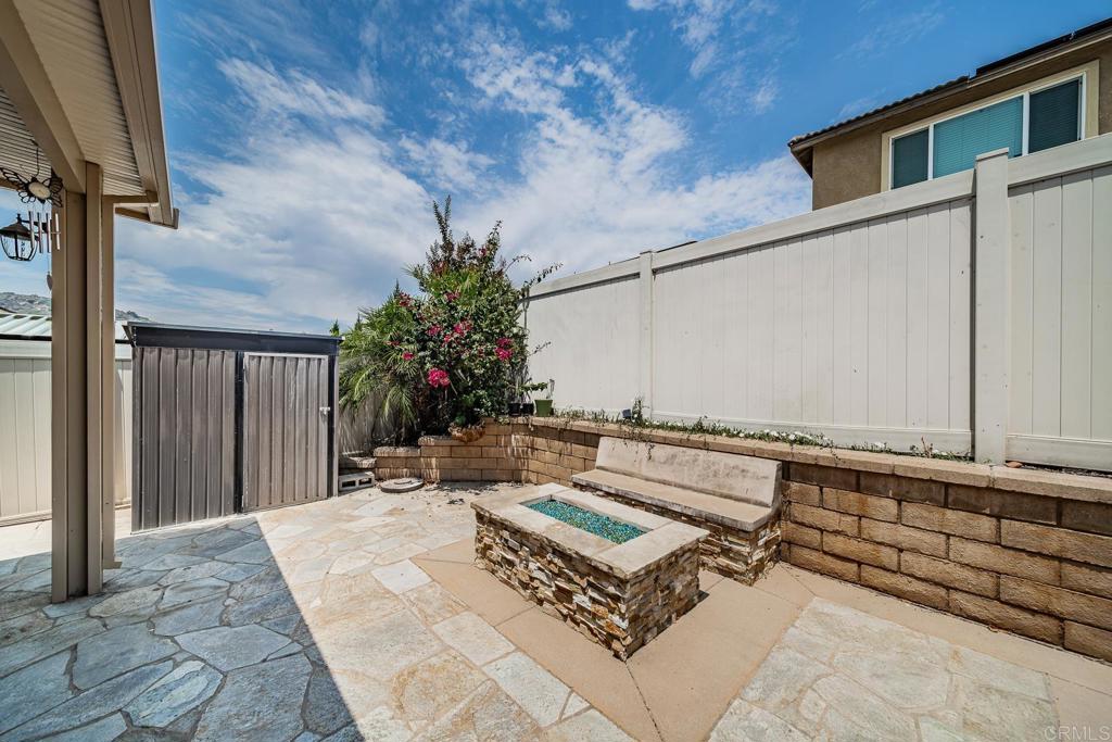 340 Falabella Lane Fallbrook, CA 92028 - Photo 24 of 63 a roof deck with table and chairs and potted plants with wooden floor