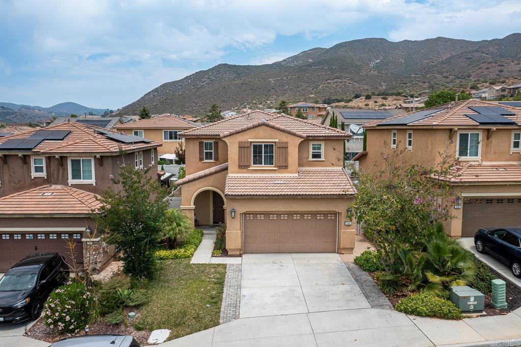 340 Falabella Lane Fallbrook, CA 92028 - Photo 45 of 63 a front view of a houses with a yard and a garage
