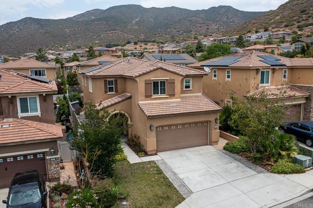 340 Falabella Lane Fallbrook, CA 92028 - Photo 46 of 63 a front view of a house with a yard and mountain view