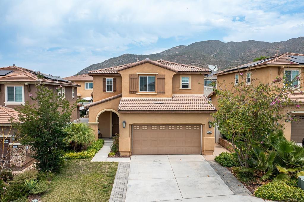 340 Falabella Lane Fallbrook, CA 92028 - Photo 62 of 63 a front view of a house with a yard and garage