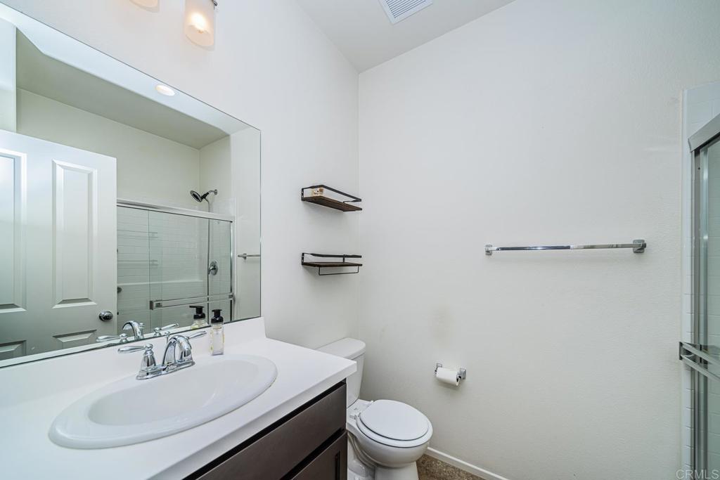 340 Falabella Lane Fallbrook, CA 92028 - Photo 7 of 63 a bathroom with a sink toilet and mirror