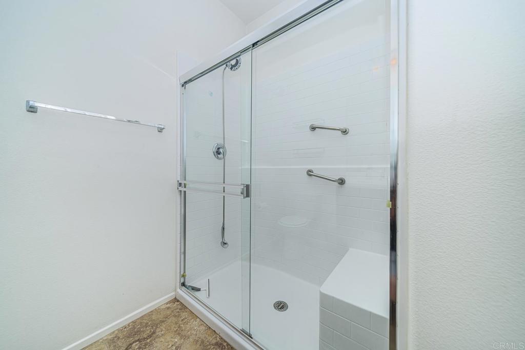 340 Falabella Lane Fallbrook, CA 92028 - Photo 8 of 63 a bathroom with a glass shower door