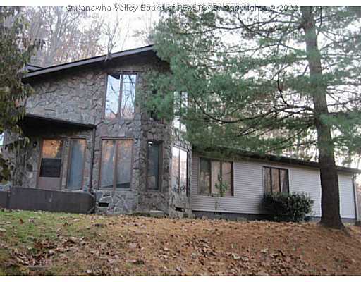Exterior Front. Beautiful Stone with new vinyl